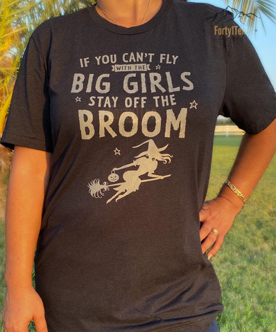 Heather Black Tee With Grey " If You Can't Fly With The Big Girls Stay Off The Broom " Design.