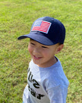 Youth Navy/Navy Trucker Cap with American Flag Patch.