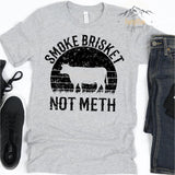 Athletic Heather Grey T-Shirt with Distressed " Smoke Brisket Not Meth " Design.